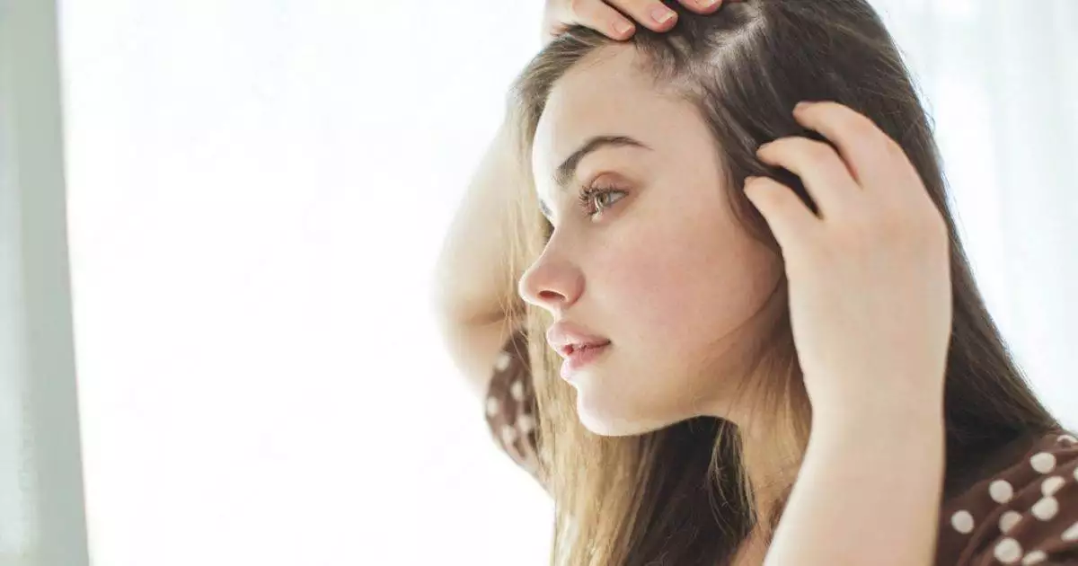 woman suffering PCOS related hair loss issue