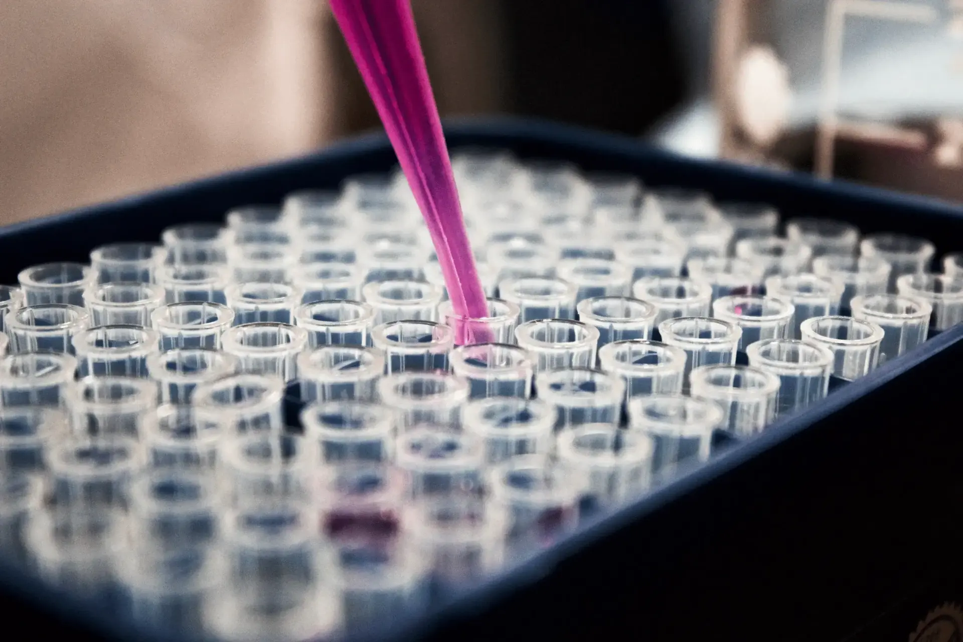 Picture of a lab flasks being filled.