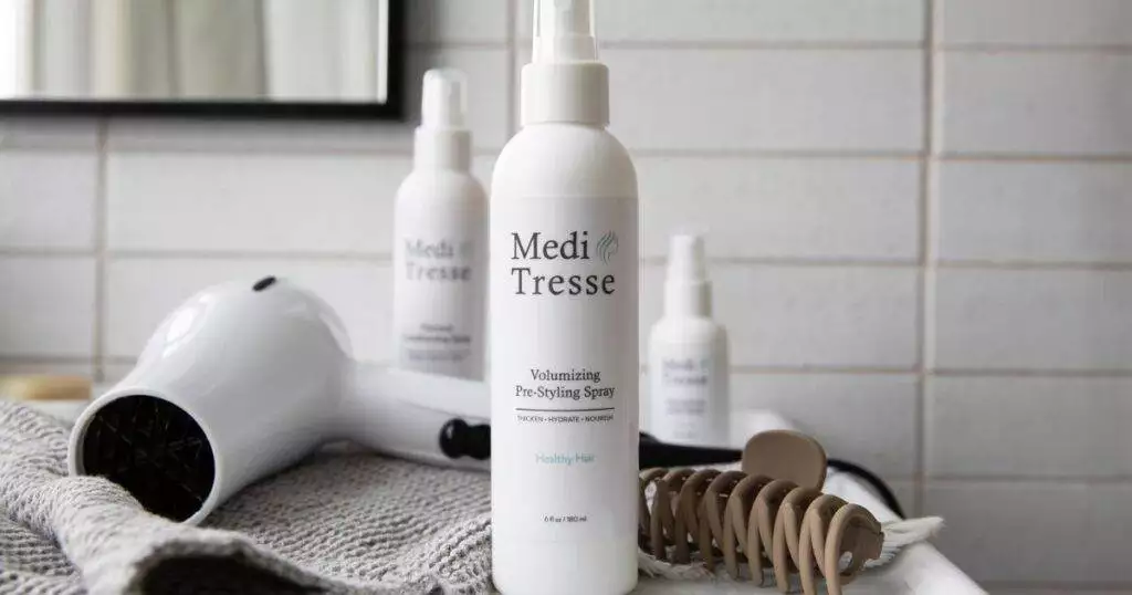 a photo of Volumizing Pre-Styling Spray are top in-home hair loss products by MediTresse.